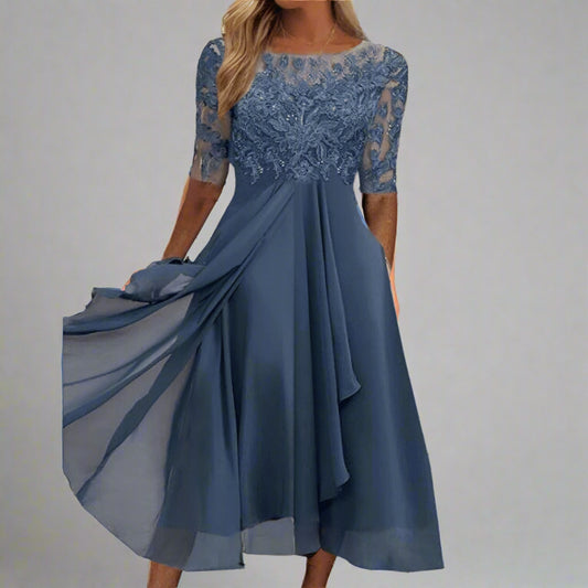 Blue lace dress with a flowing skirt 
